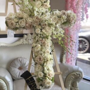 Blush and white flowers cross.