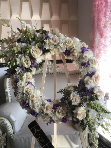 White orchid sprays wreath. Classic whites and purples.