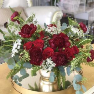 red Peony are paired with beautiful velvety red roses in this garden style arrangement