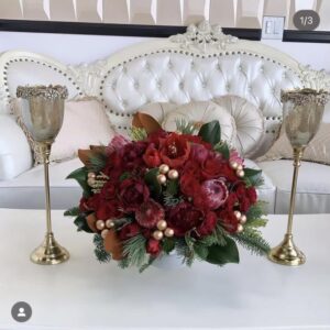 velvety reds and rich winter greens holiday arrangement